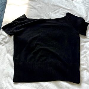Size Large black short sleeve knit top.   Looks great alone or under a blazer